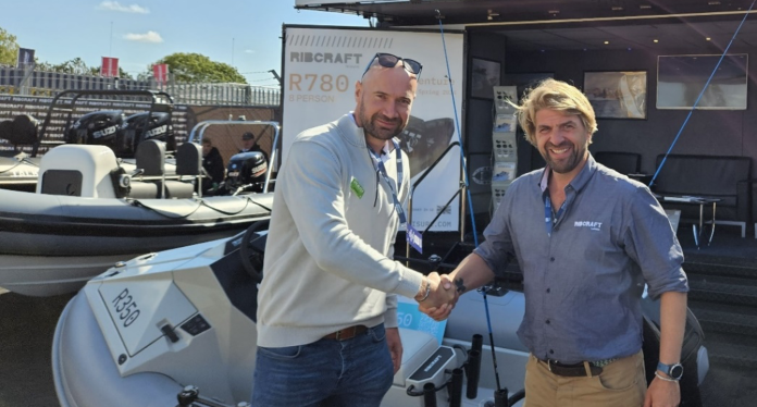 Nick Edgington (left), sales director for RAILBLAZA, congratulates Olly Stevens (right), global sales manager for Ribcraft, on the launch of the new Ribcraft 350 Adventure RIB