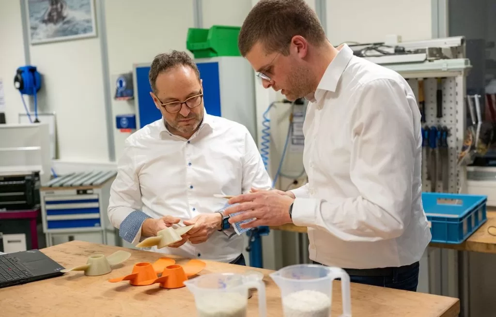 Dr Alex Oswald and Florian Deger examine prototype props in Torqeedo's R&D lab